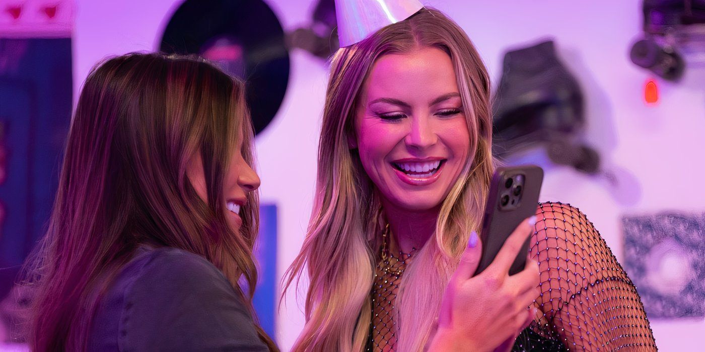 The Secret Lives of Mormon Wives' Mayci Neely looking at a phone held up by a friend