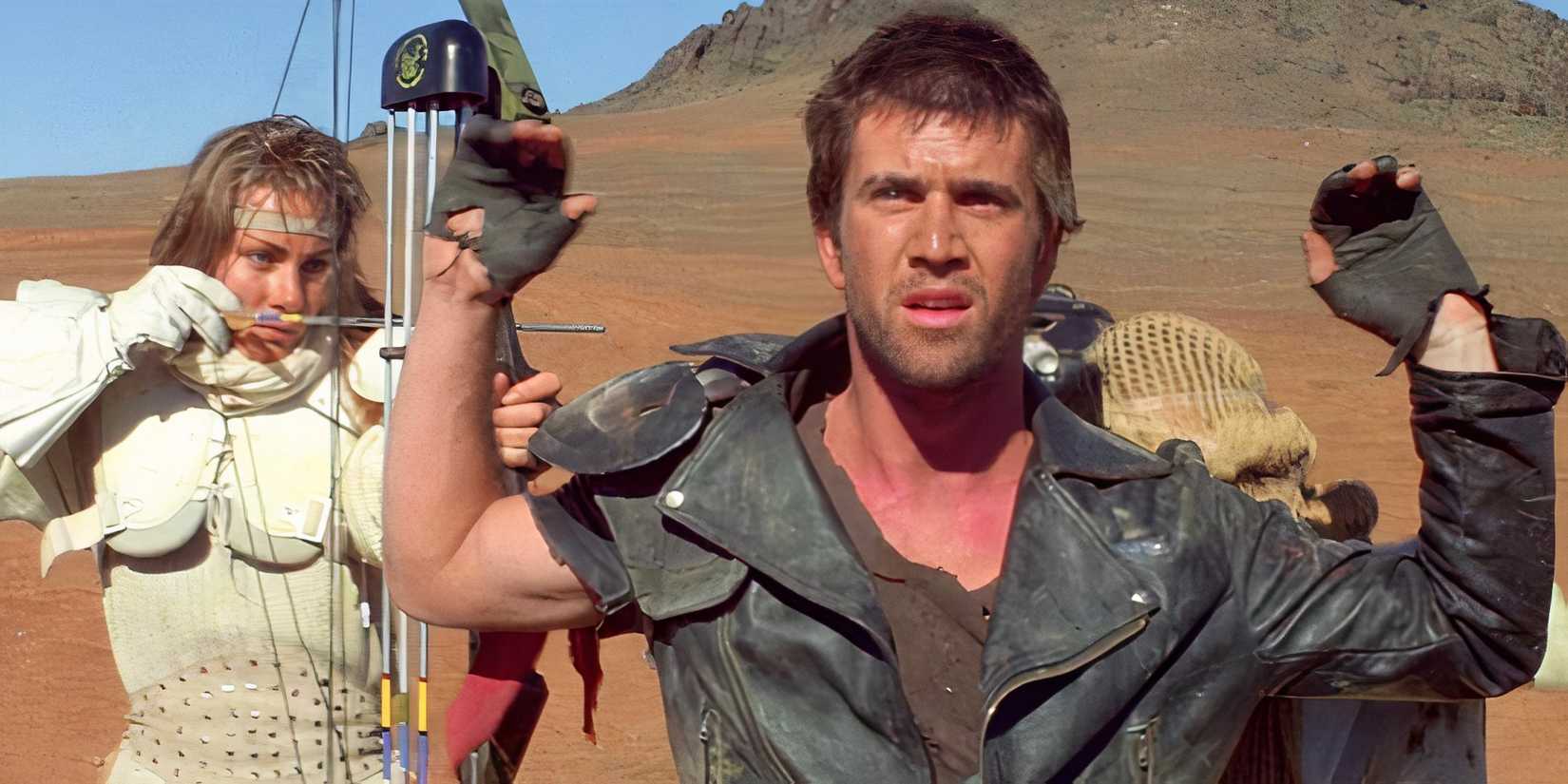 Virginia Hey threateningly points a bow and arrow at Mel Gibson. 