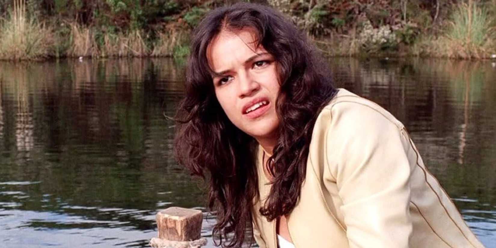 Michelle Rodriguez The Breed 2006 standing next to a lake 