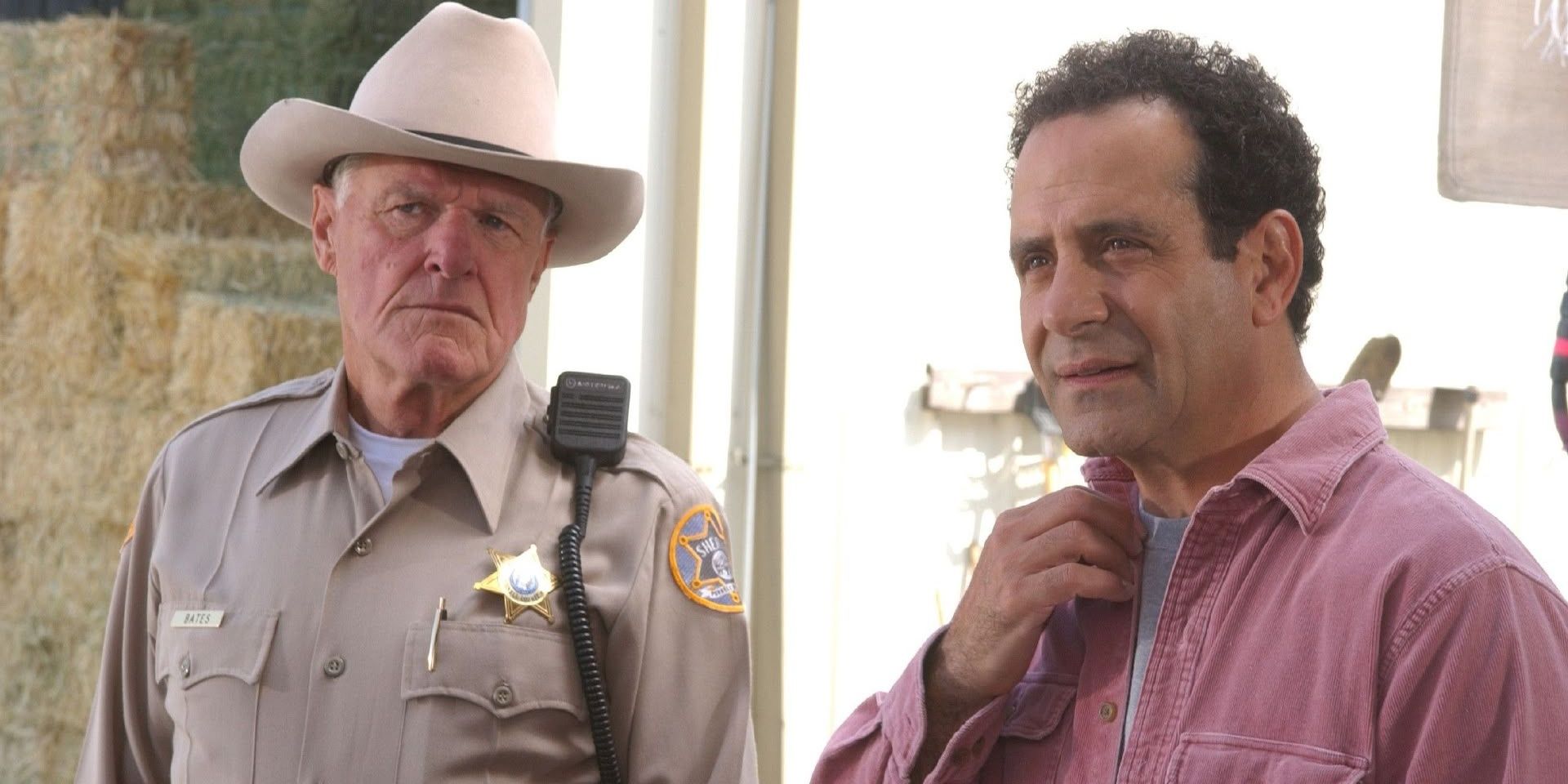 Monk and the sheriff talking to the suspect in