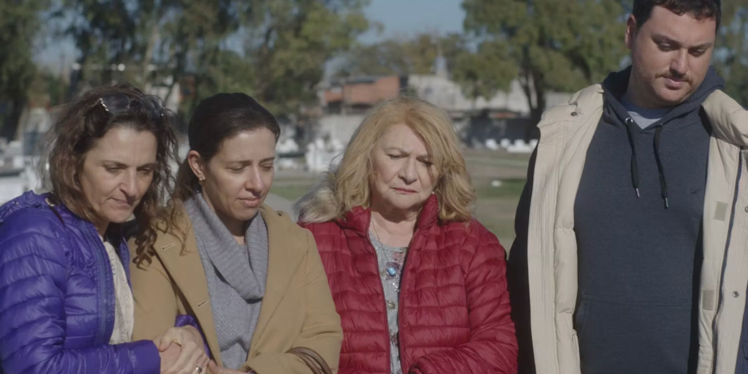 Most People Die on Sundays cast looking sad 