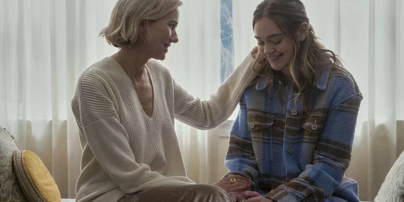 Naomi Watts brushing Isabel Gravitt's hair back in The Watcher