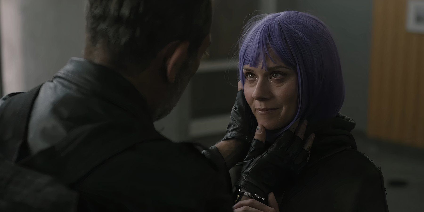 Negan (Jeffrey Dean Morgan) holding Lucille's (Hilarie Burton) face as she looks into his eyes in The Walking Dead: Dead City season 2