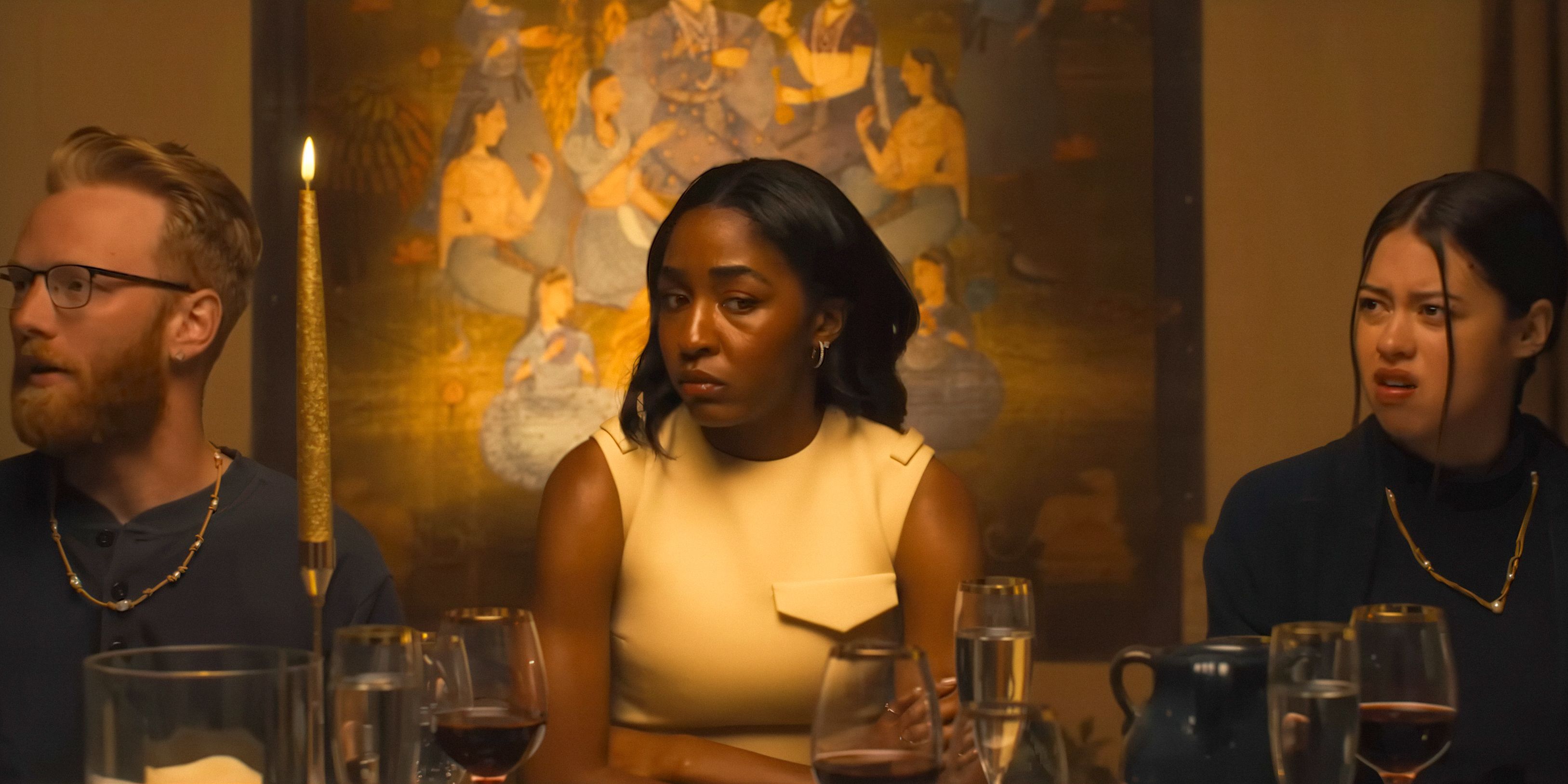 Ariel Ecton (Ayo Edebiri) looking thoughtful during the dinner with Moretti's cult in Opus (2025)