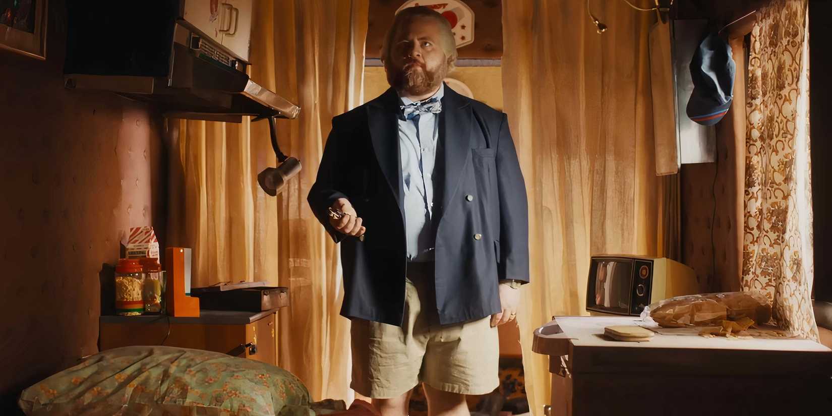 Paul Walter Hauser as Michael standing awkwardly in his RV in The Luckiest Man in America