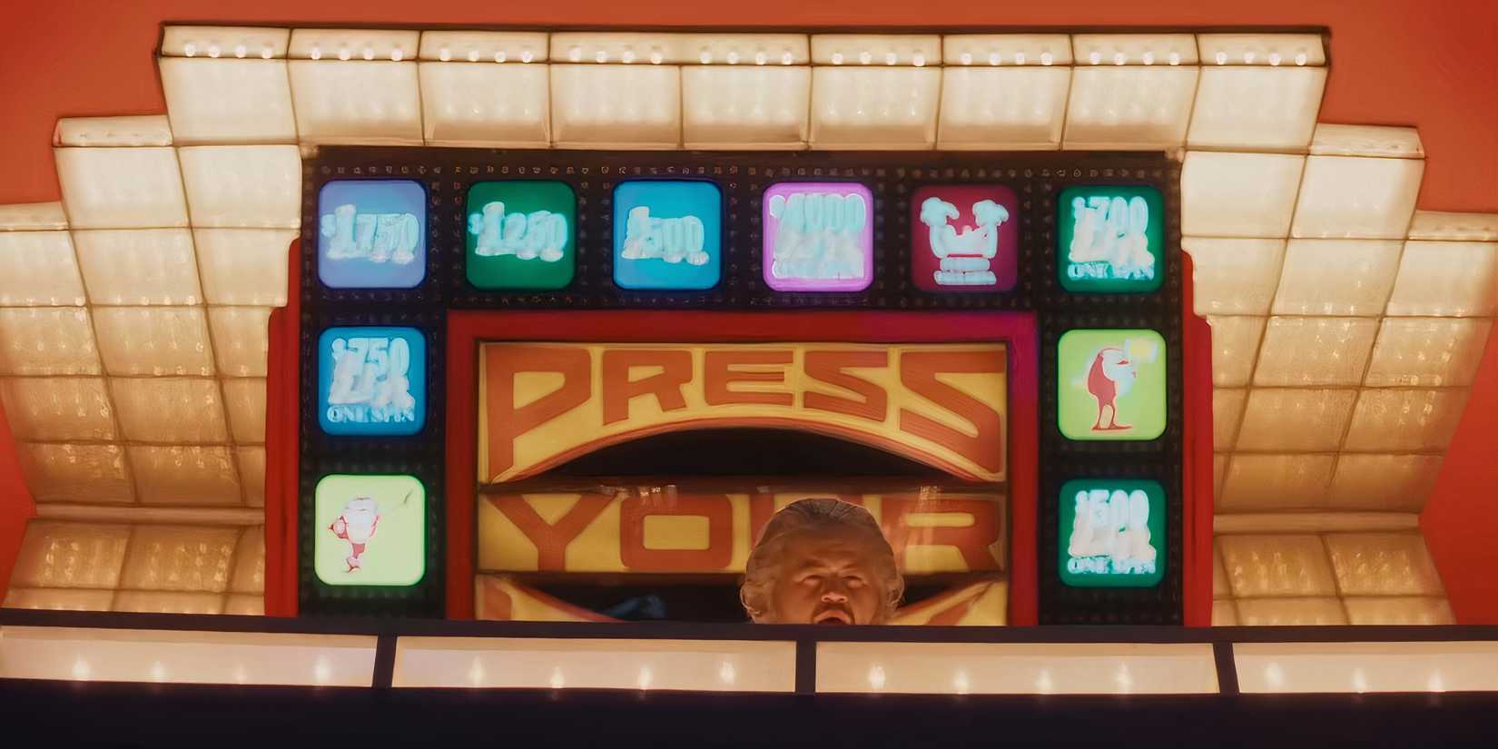 Paul Walter Hauser's Michael looking over a wall on the Press Your Luck stage in The Luckiest Man in America