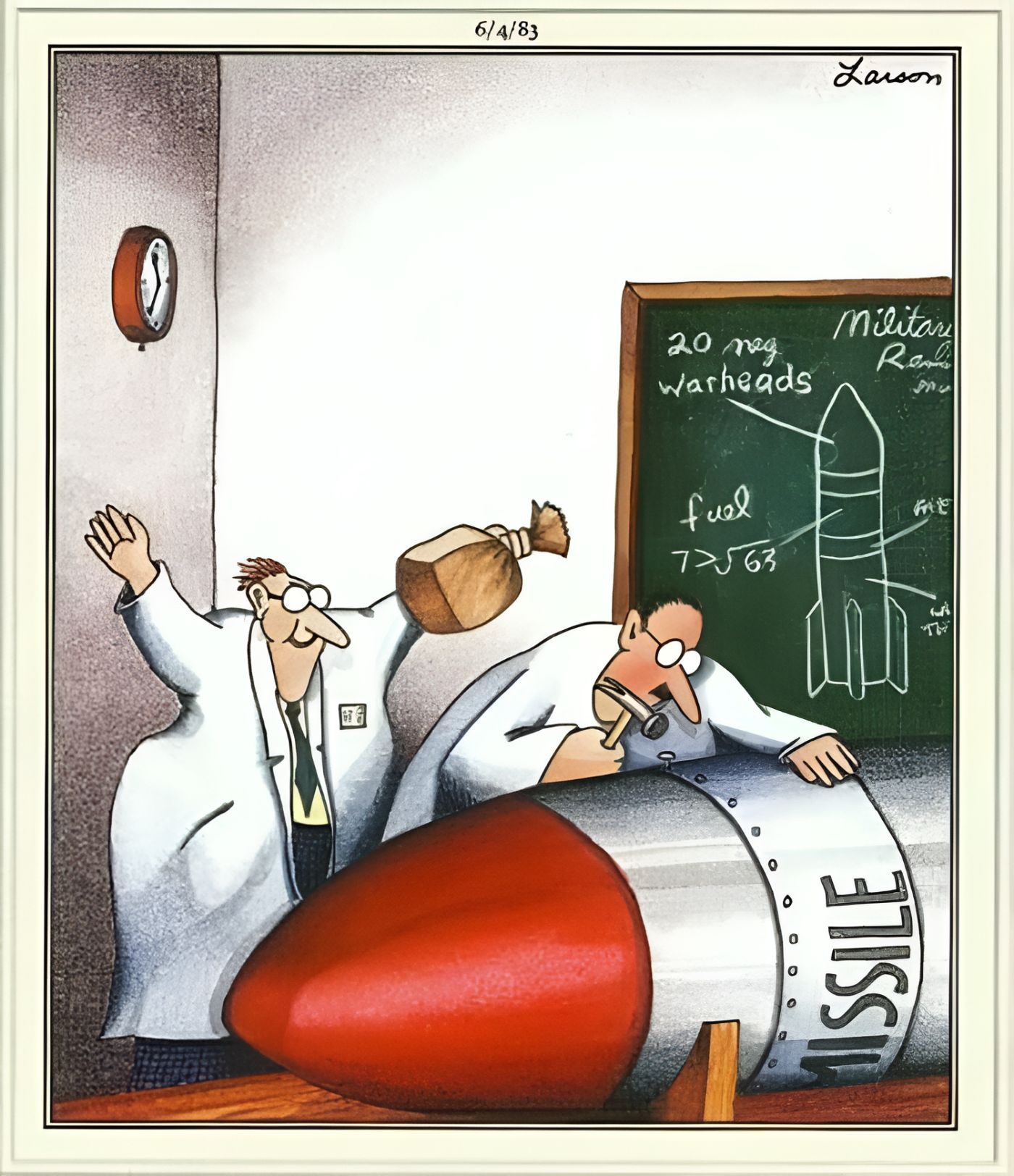 One scientist is about to pop a paper bag while another hammers in nails into a missile.