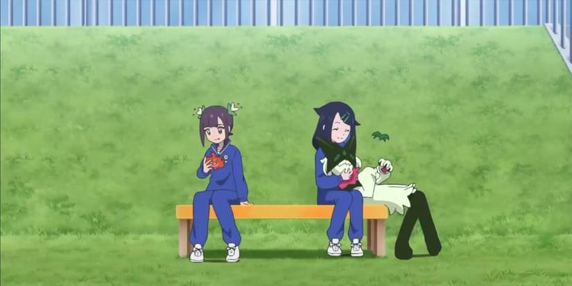 Liko and Ann sit on a bench and discuss the Blueberry Academy.