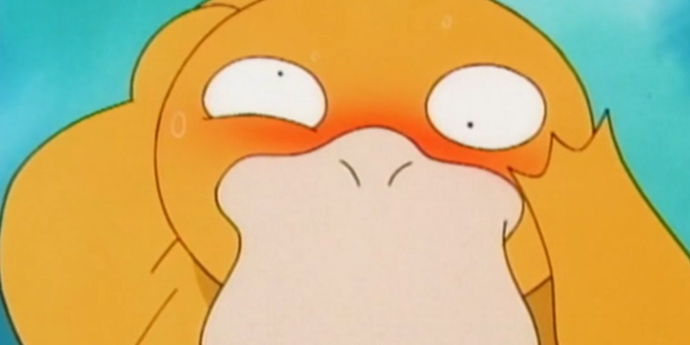 Psyduck con espressione dolorante mentre tiene la testa