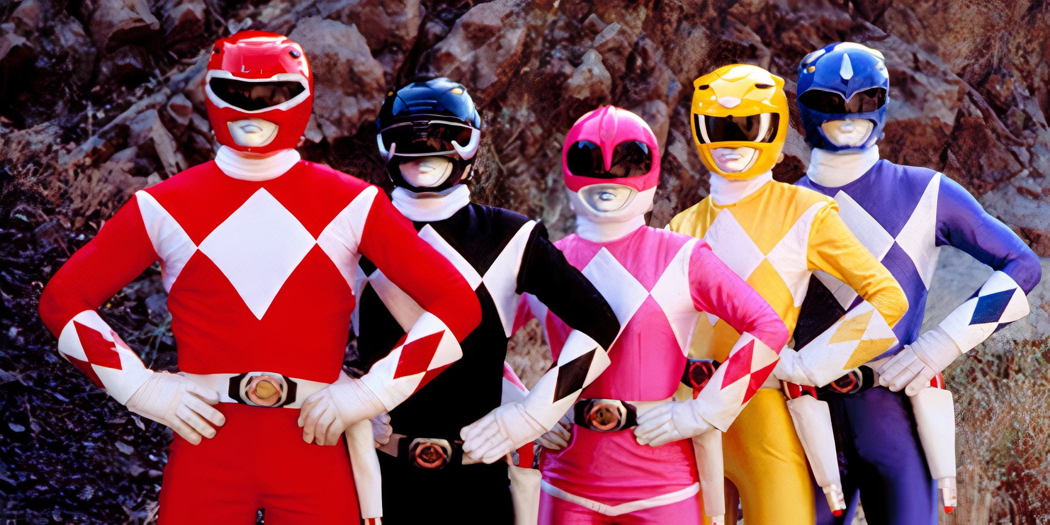 The Power Rangers posing with their hands on their hips in Mighty Morphin Power Rangers