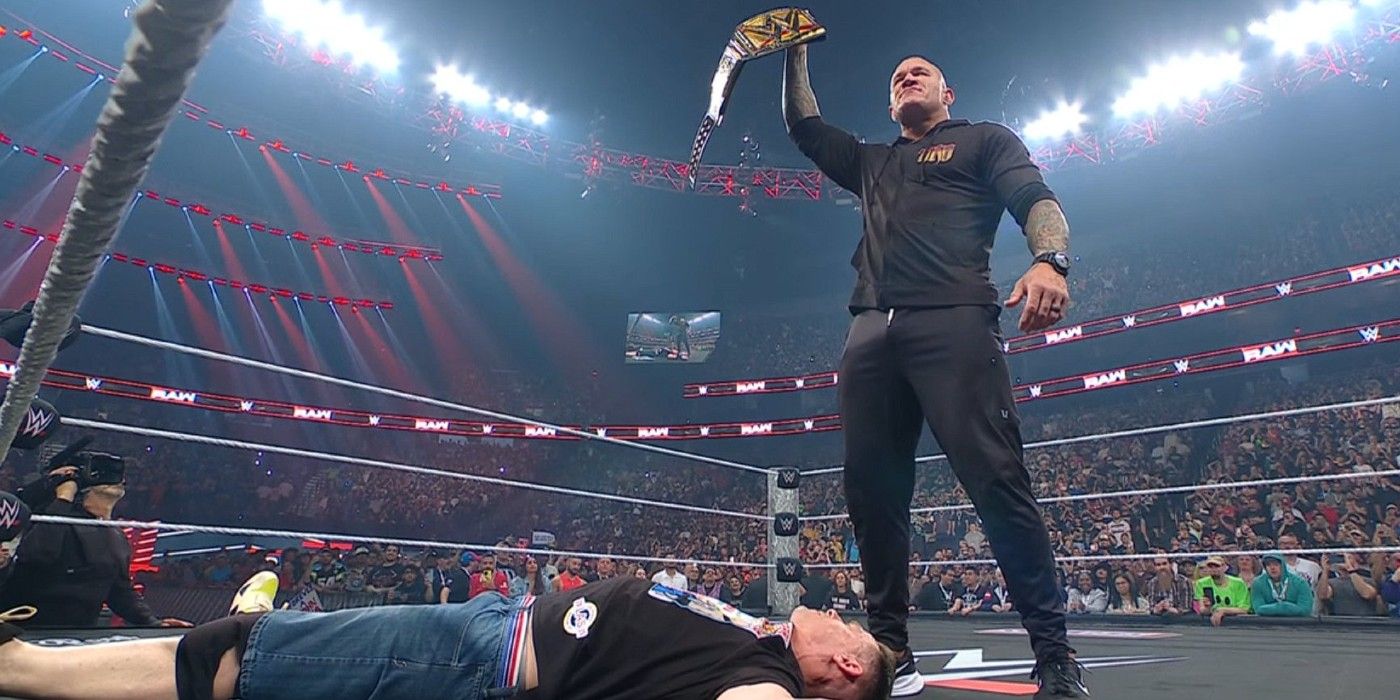 Randy Orton holds the WWE Championship over John Cena on Monday Night Raw