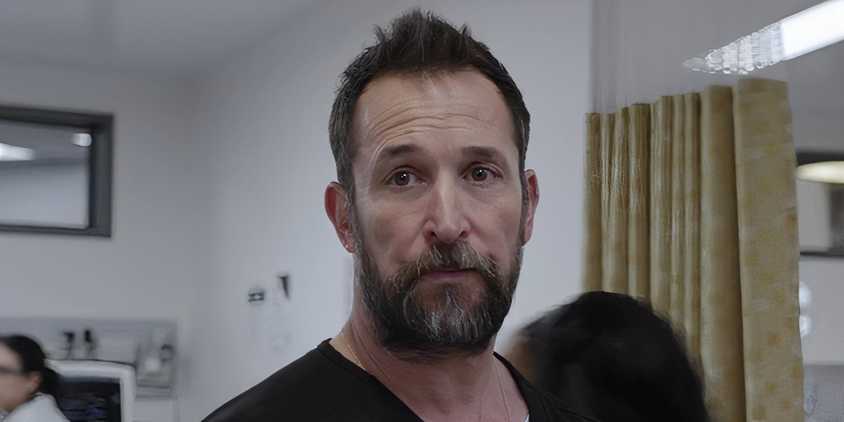 Robby looking somberly out at the hospital in The Pitt episode 14