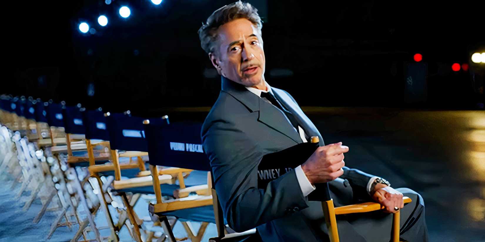Robert Downey Jr sitting in a set chair with the Avengers: Doomsday cast