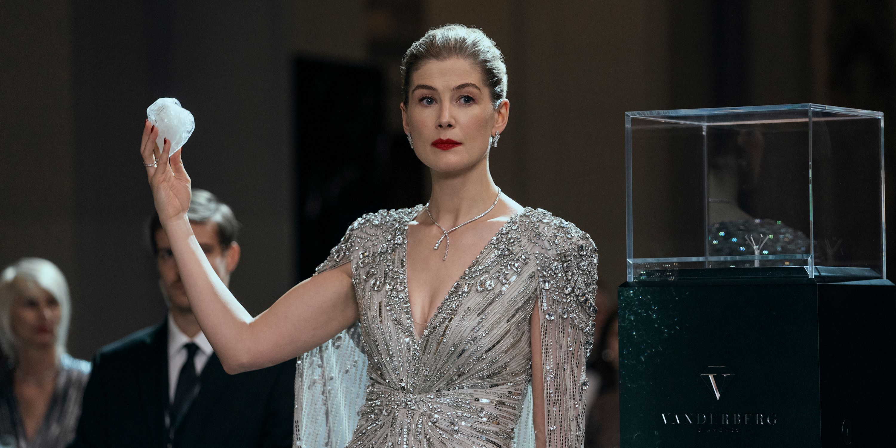 Rosamund Pike holding a diamond in Now You See Me 3