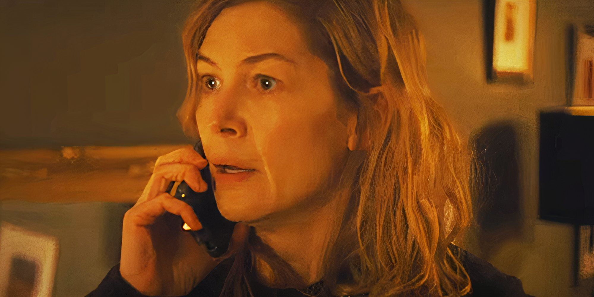 Rosamund Pike talks dramatically into a phone in a scene from Hallow Road