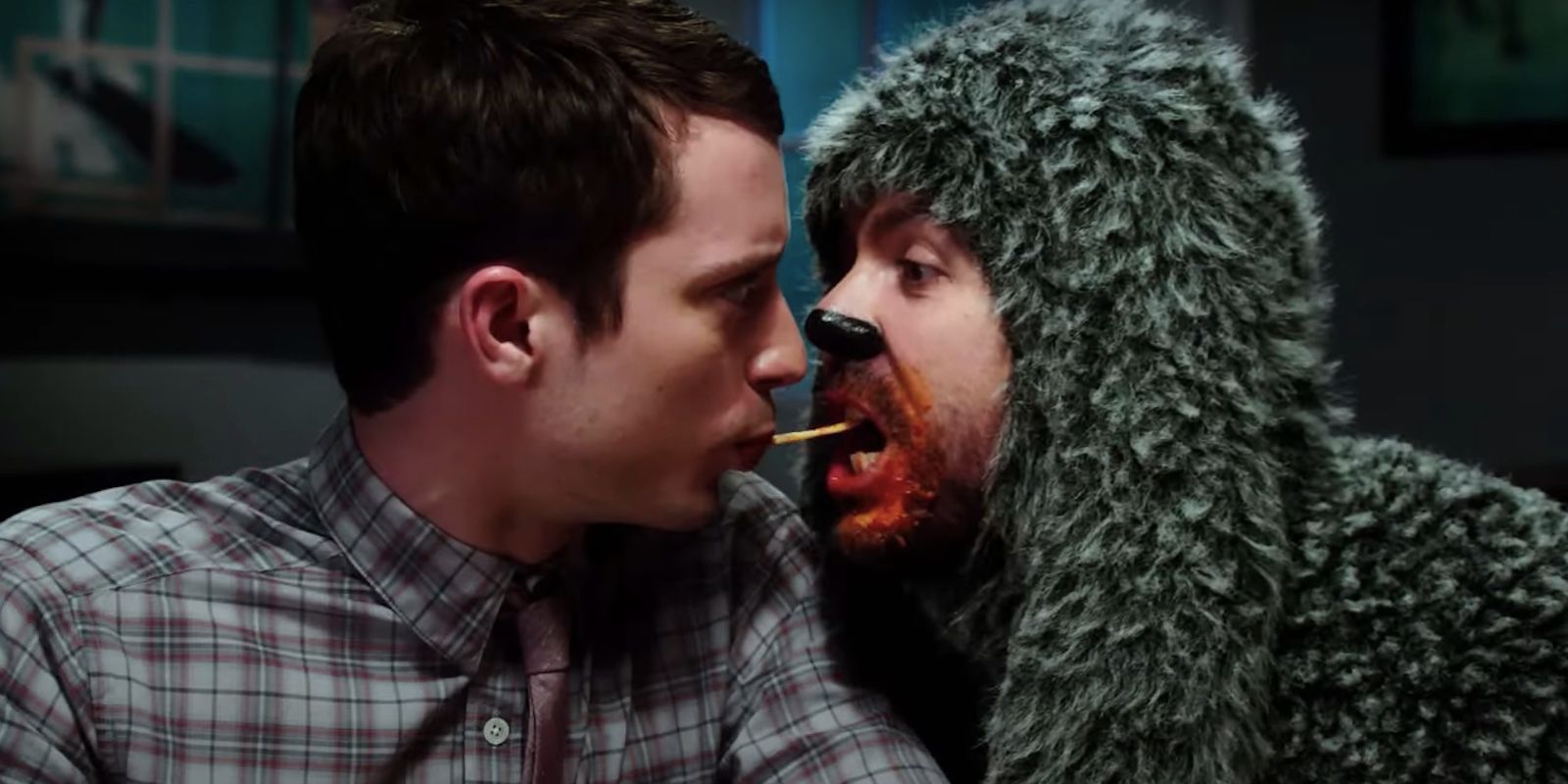 Ryan (Elijah Wood) and Wilfred (Jason Gann) sharing food in the Wilfred trailer