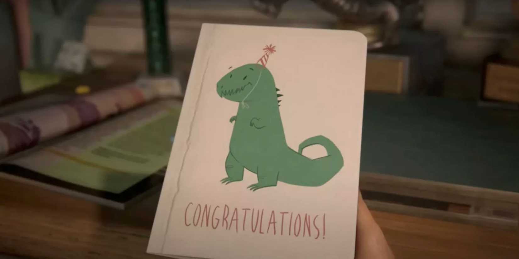 Sarah holds a card with a dinosaur on it in The Last of Us video game