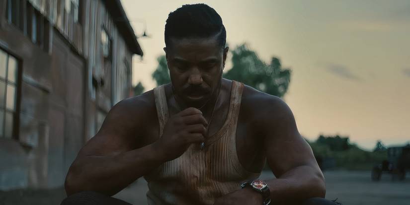 Michael B. Jordan sitting down in Sinners