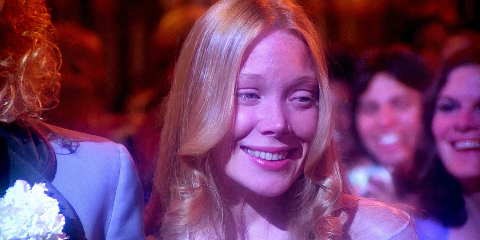 Sissy Spacek as Carrie smiling while going to prom