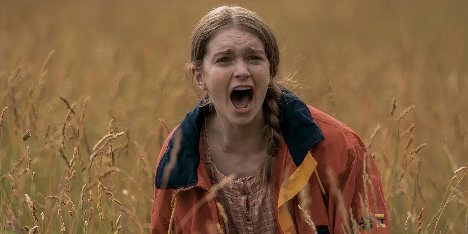 Summer H. Howell screaming in a field in Spirit in the Blood