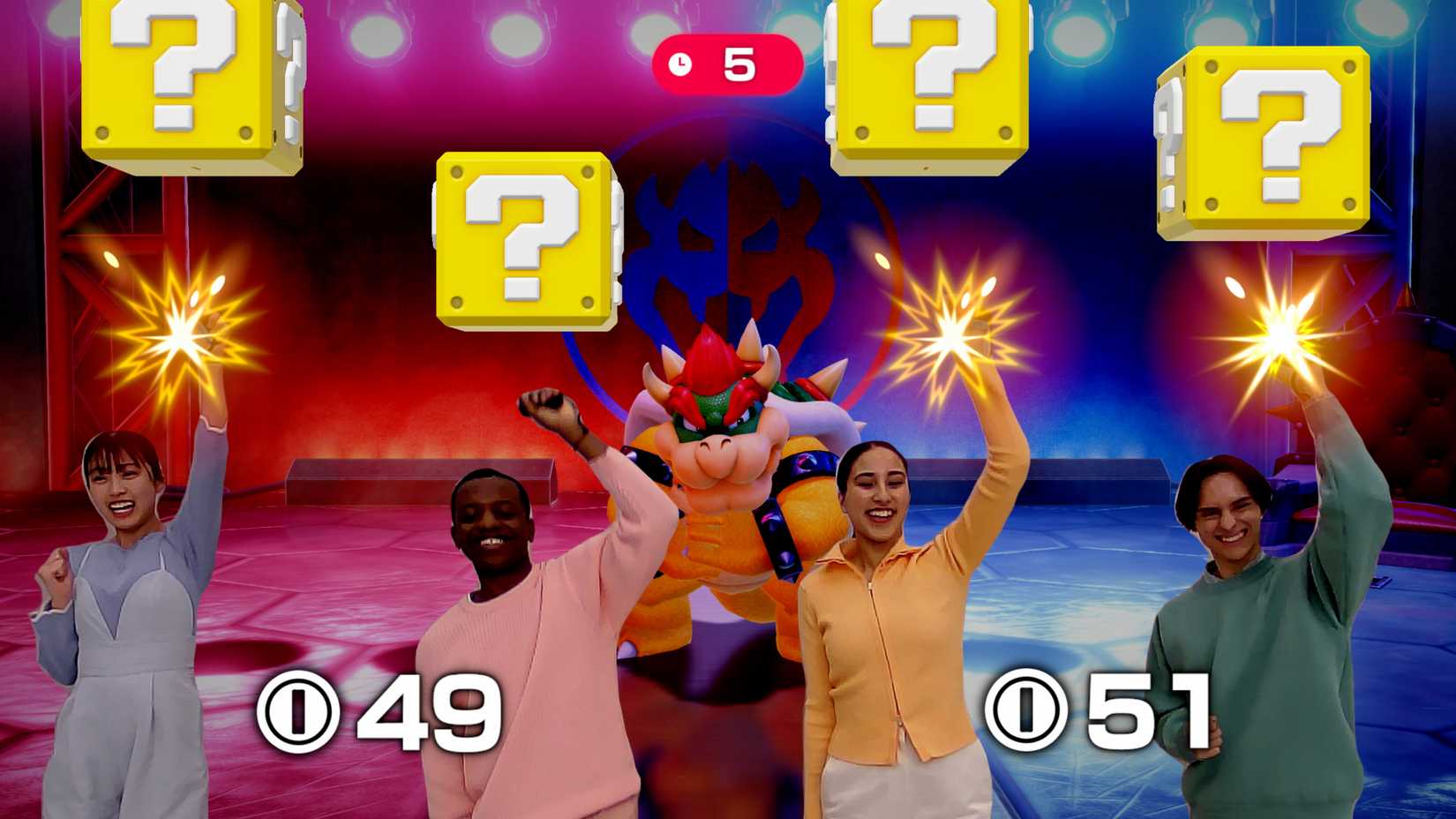 Super Mario Party Nintendo Switch 2 version showing four players on camera punch at ? blocks.