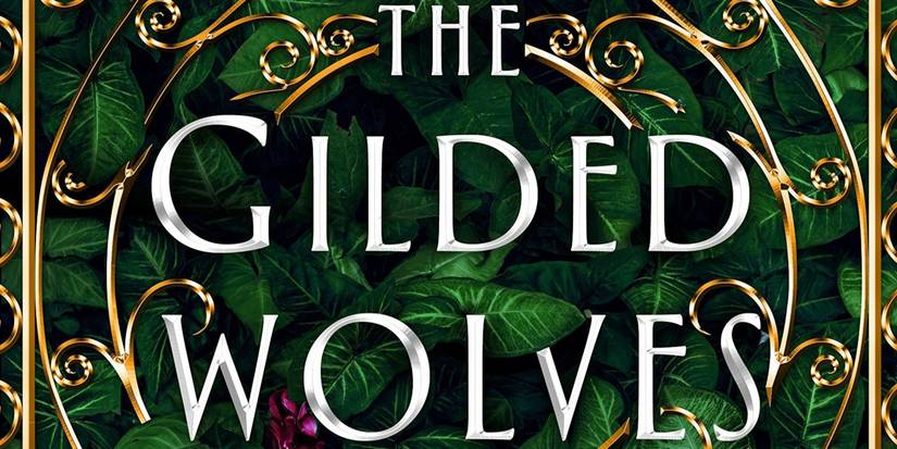 The Gilded Wolves Cover featuring the title in silver, golden designs, and green leaves as the background