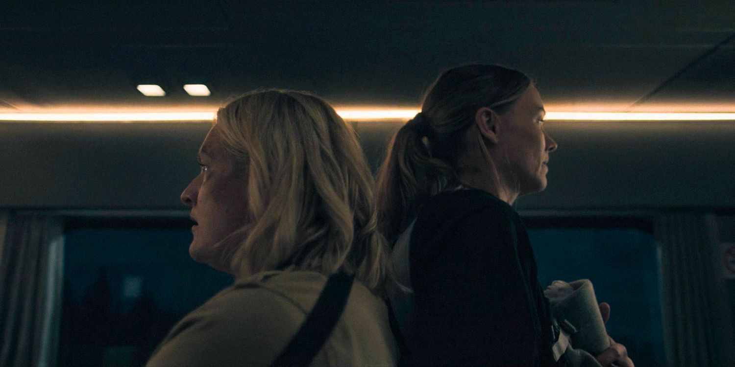 June (Elisabeth Moss) and Serena (Yvonne Strahovski) back to back, trying to protect themselves in The Handmaid&rsquo;s Tale Season 6 Ep 1