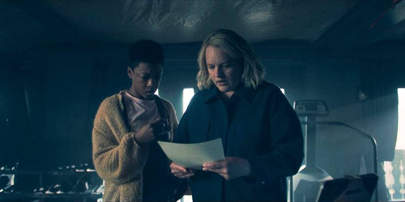 Moira (Samira Wiley) and June (Elisabeth Moss) looking shocked at a fax with Janine's photo in The Handmaid's Tale Season 6 Ep 4