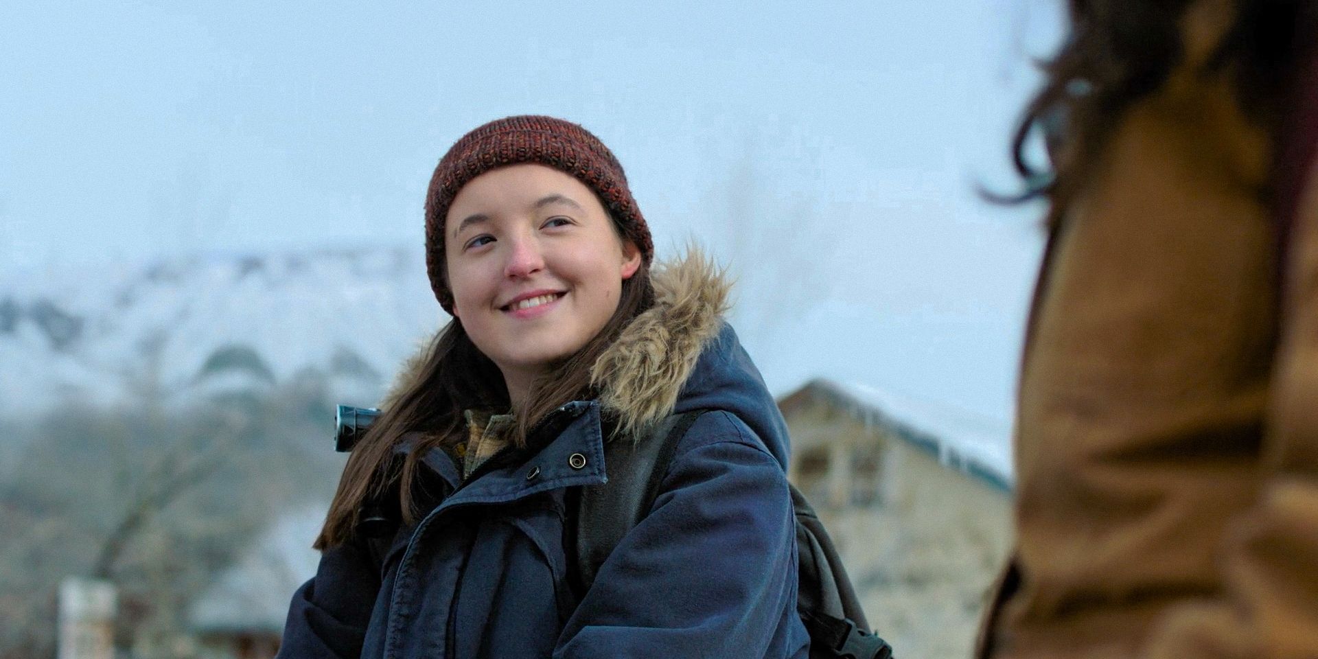Ellie Williams (Bella Ramsey) with a smile in The Last of Us Season 2 Ep 1