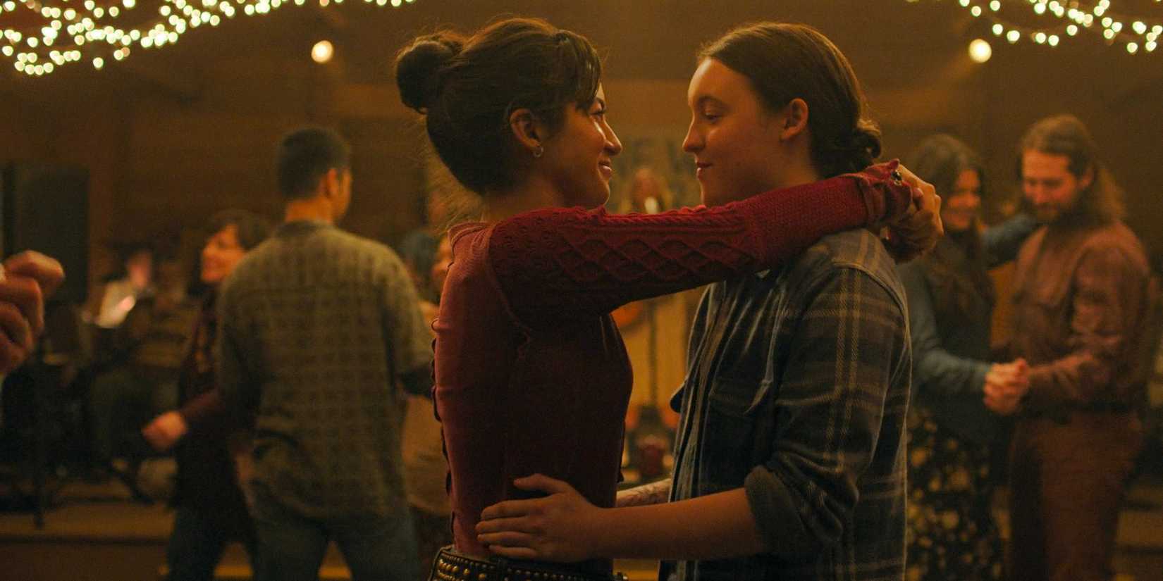Ellie Williams (Bella Ramsey) and Dina (Isabela Merced) dancing together in The Last of Us Season 2 Ep 1