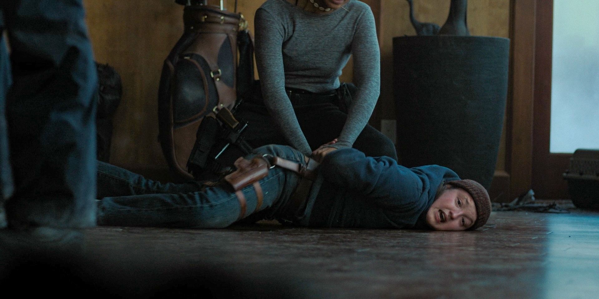 Ellie Williams (Bella Ramsey) is knocked to the ground in The Last of Us Season 2 Ep 2