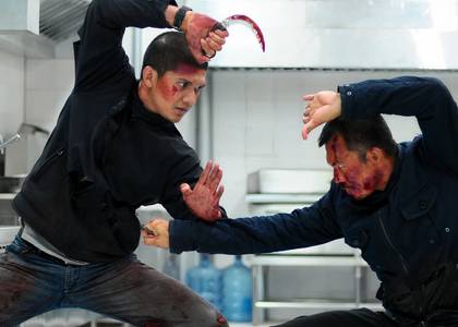 Iko Uwais squaring up to an opponent in The Raid 2