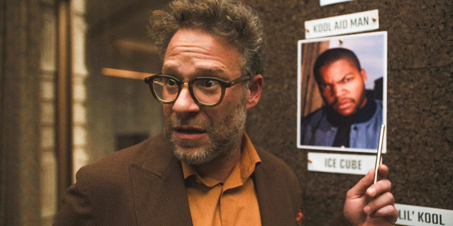 Matt (Seth Rogen) looking worried while pointing at the photo of Ice Cube in The Studio Season 1 Episode 7