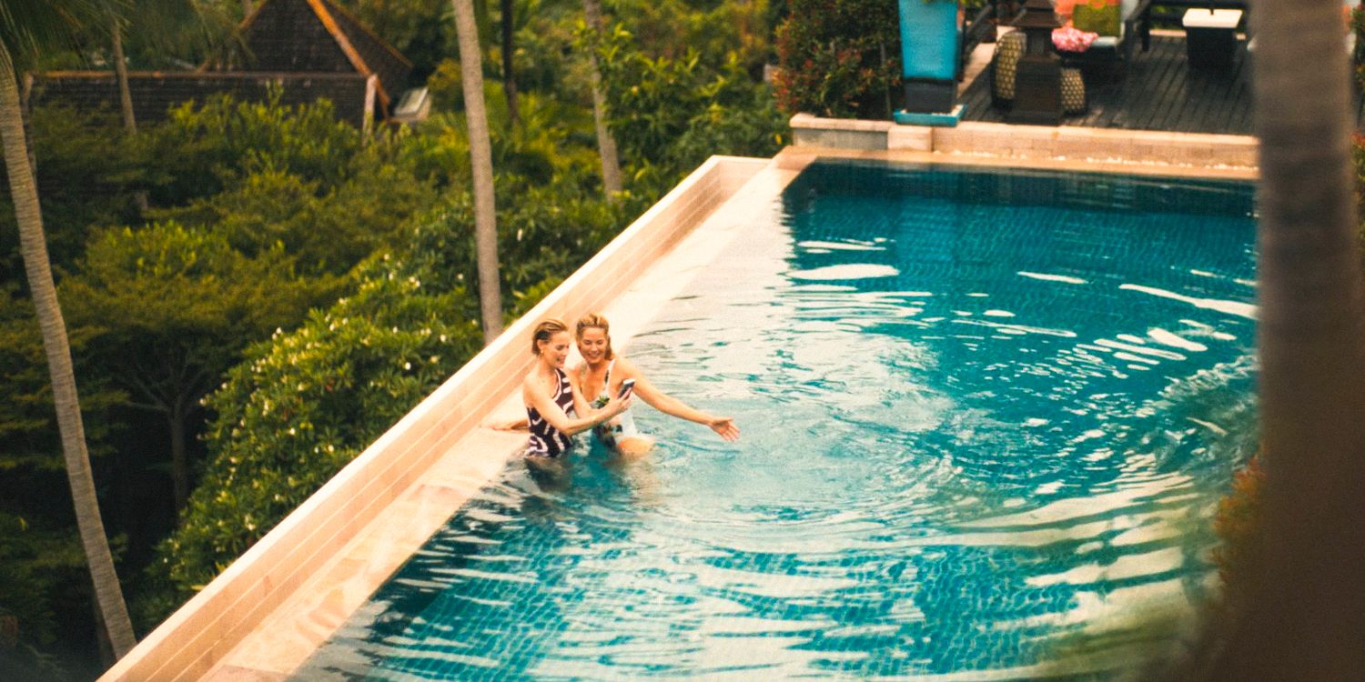 Kate and Jaclyn taking selfies by the pool in The White Lotus Season 3 Ep 8