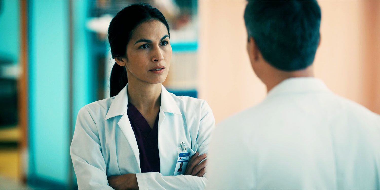 Thony in The Cleaning Lady season 4, episode 2, talking to a doctor, with arms crossed