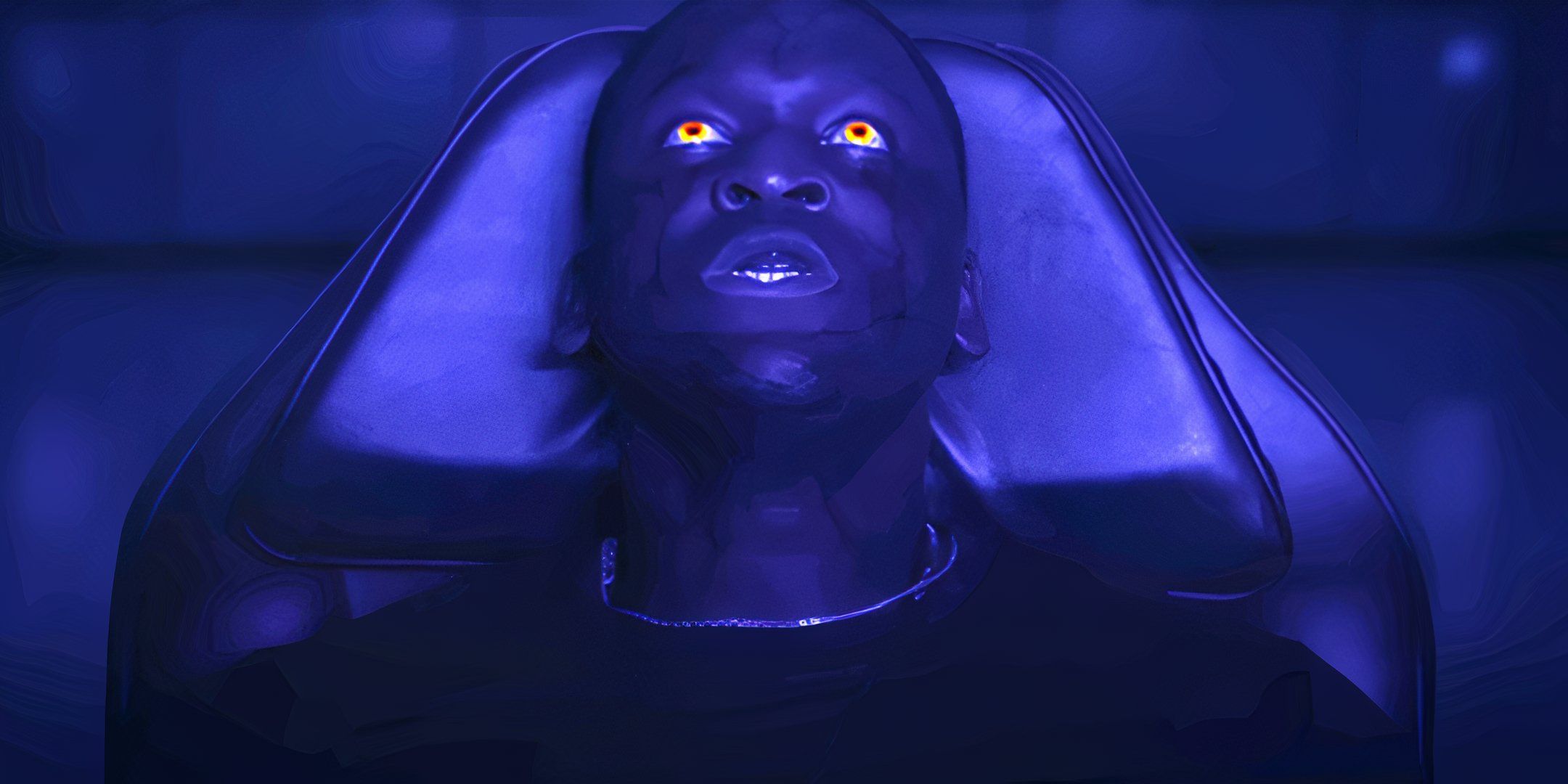 TJ with glowing eyes in a lab chair in The Grove