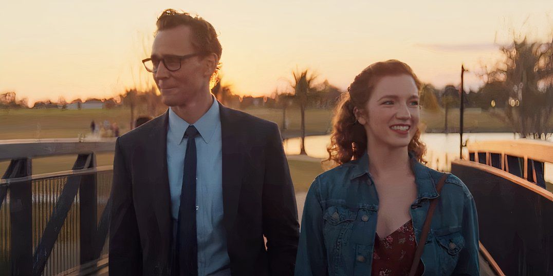 Tom Hiddleston as Chuck looking emotional while walking with Annalise Basso as Janice in The Life of Chuck