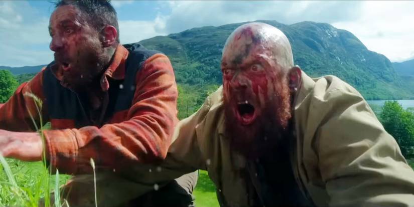 Two Infected snarling atop a hill in 28 Years Later