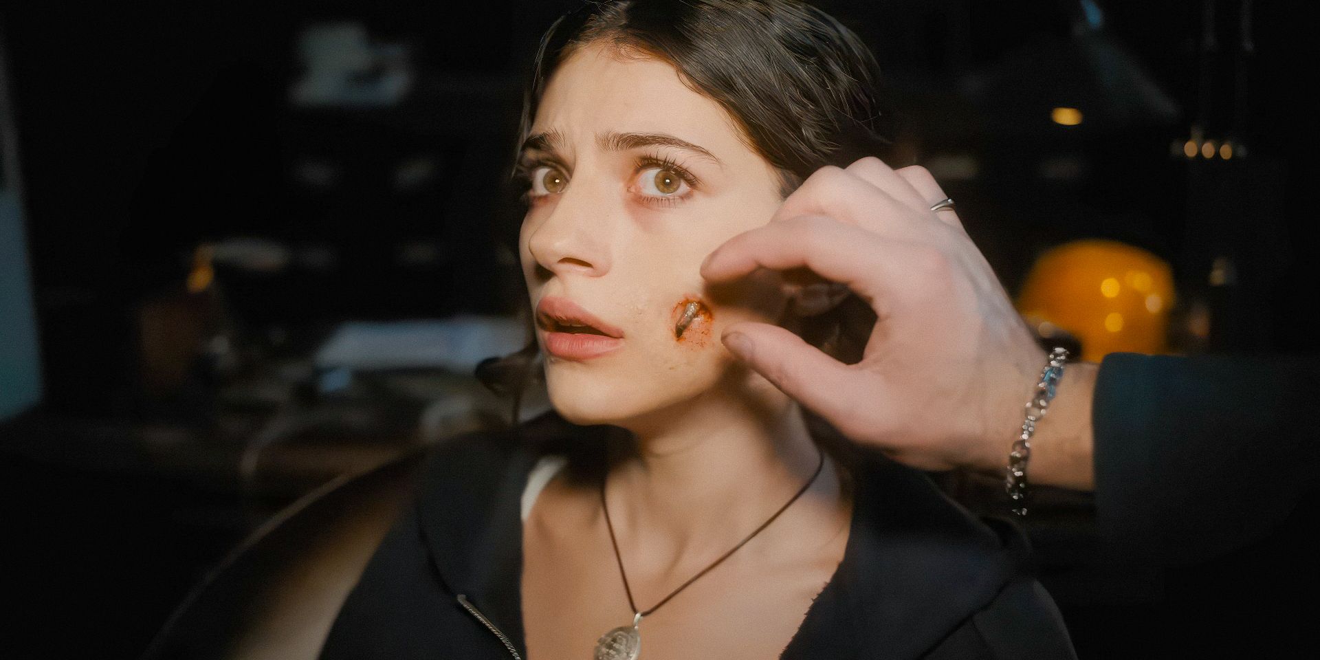 Clover (Ella Rubin) grows a claw from her cheek in Until Dawn
