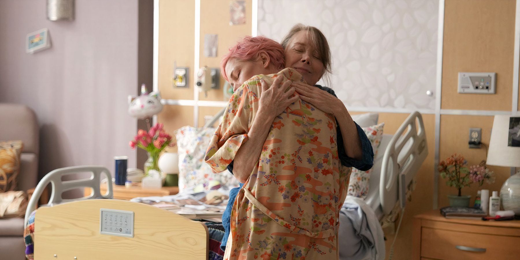 Molly and Gail embracing in the hospital
