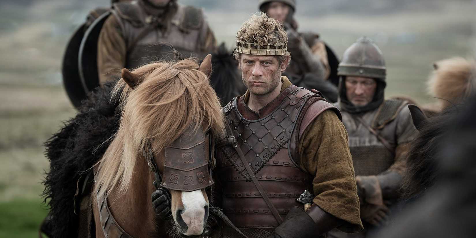 James Norton as Harold Earl of Wessex wearing period costume and crown with a horse