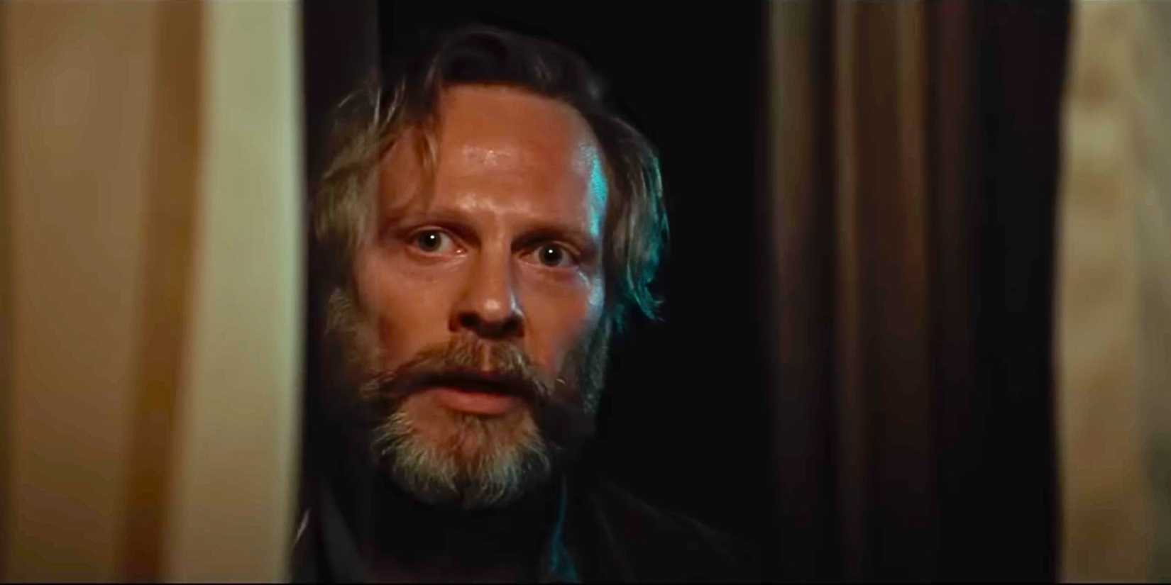 Jan Bluthardt as Henry in Cuckoo looking through a doorway