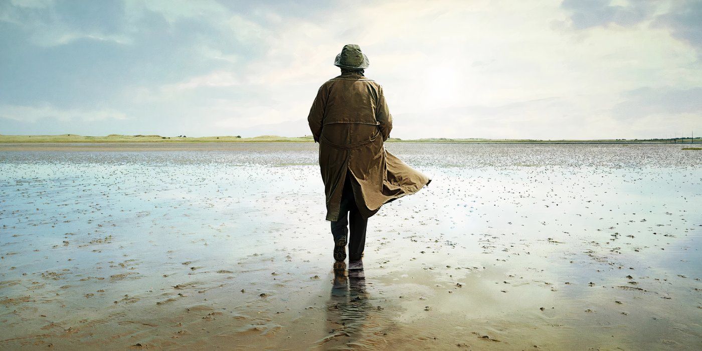 Vera walking along a beach at the end of Vera season 14
