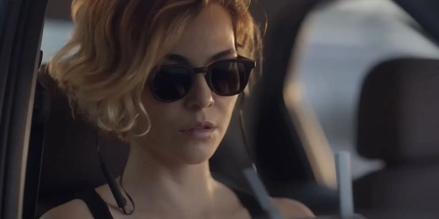 Veronica (Taina Muller) wearing sunglasses in a car in Good Morning Veronica.