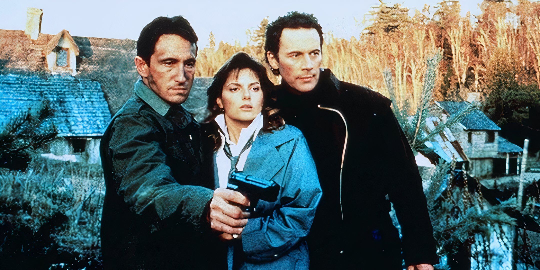 Two men, one holding out a weapon, pose on opposite sides of a woman. 