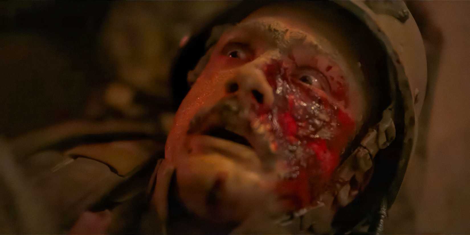 Cosmo Jarvis with a large wound on his face in Warfare