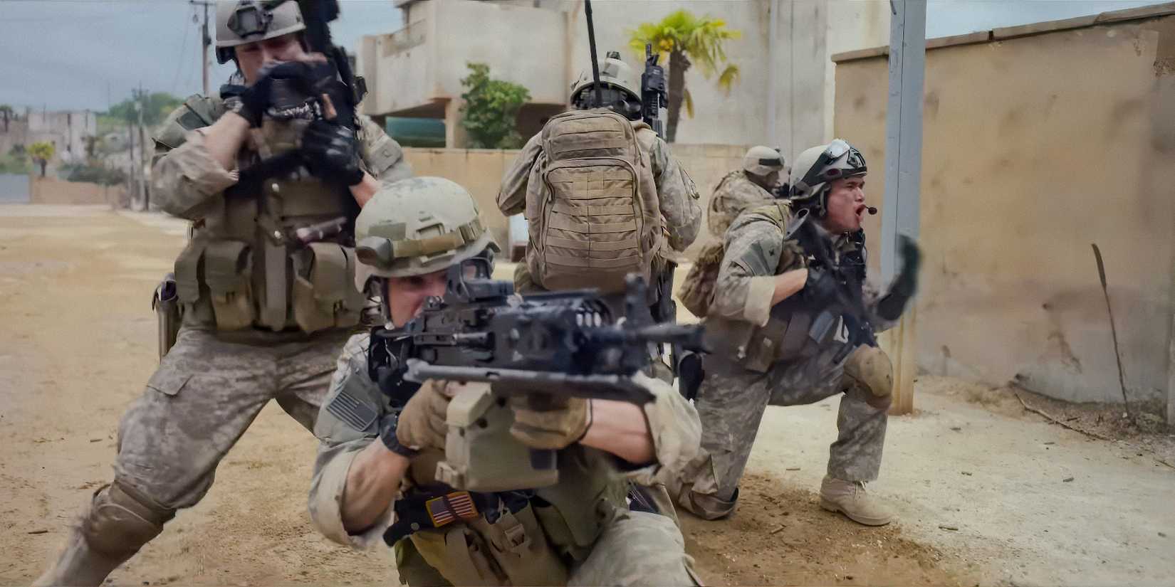 Soldiers spread out with guns raised in Warfare