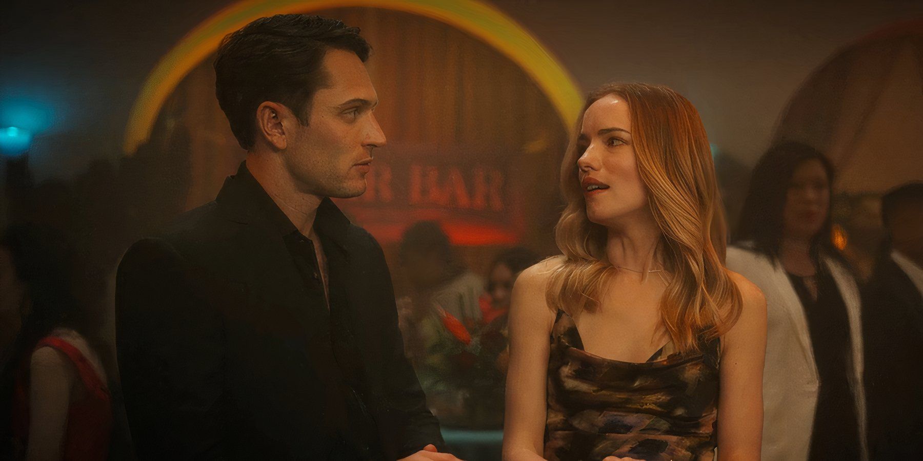 Colin Woodell and Willa Fitzgerald at a bar talking in Pulse