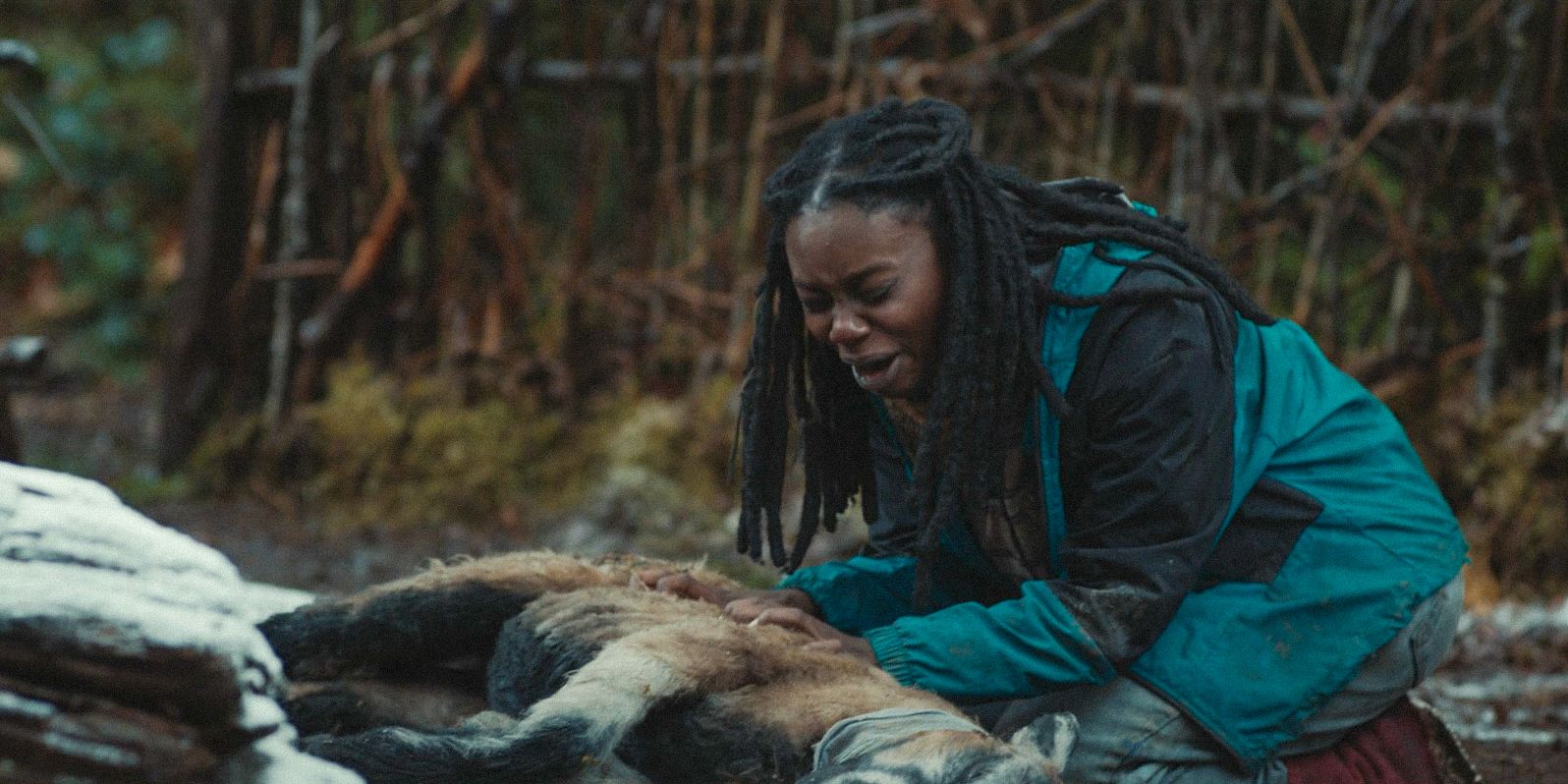 Teen Akilah (Nia Sondaya) crying over the dead animals in Yellowjackets Season 3 Ep 10