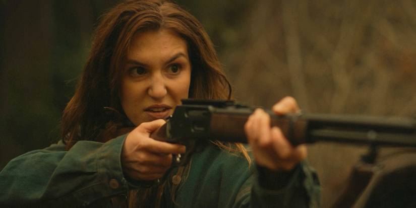 Teen Shauna looking furious and aiming a gun in Yellowjackets season 3, episode 9